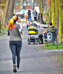 Image showing Young mother with  pram 