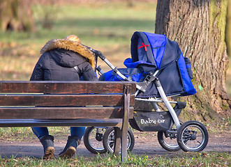 Image showing Young mother with  pram 