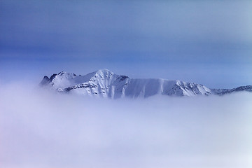 Image showing Snowy mountains in fog