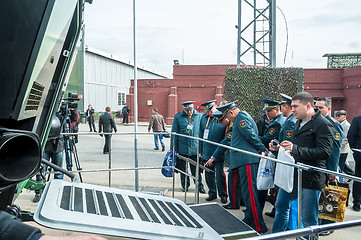 Image showing Officers of Kazakh army examine troop-carrier