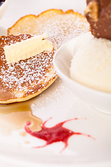 Image showing tasty sweet pancakes with vanilla icecream and topping