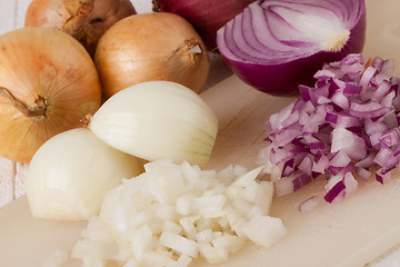 Image showing Whole, peeled and diced brown onion