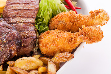 Image showing Platter of mixed meats, salad and French fries