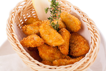 Image showing Crumbed chicken nuggets in a basket