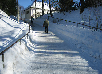 Image showing Walking a Norwegian pavement at wintertime