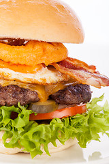 Image showing Delicious egg and bacon cheeseburger