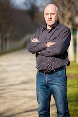 Image showing Confident attractive man standing waiting