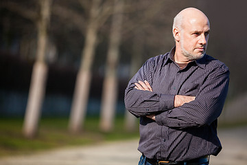 Image showing Confident attractive man standing waiting