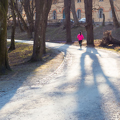 Image showing Female runner in the forest. 