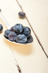 Image showing fresh blueberry on silver spoon