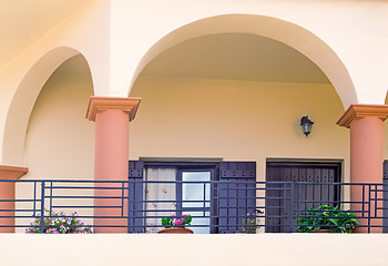 Image showing Detail of the facade of an old house with balconies and a sun aw