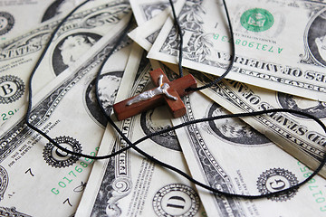 Image showing wooden cross on the dollar banknotes