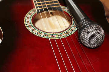 Image showing dark guitar and microphone