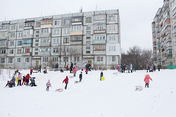 Image showing children are sleding from the hill