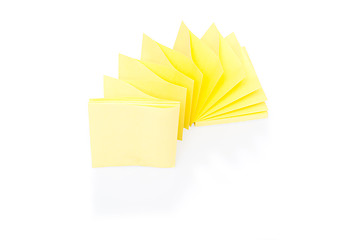 Image showing Blank yellow sticky note on block