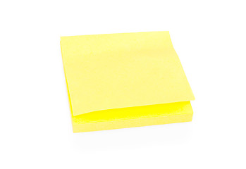 Image showing Blank yellow sticky note on block