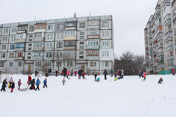Image showing children are sleding from the hill