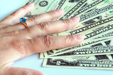 Image showing woman's hand purchasing the ring with topaz