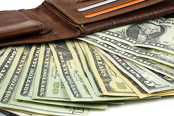 Image showing Leather wallet full of Dollar banknotes