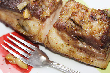 Image showing baked piece of meat on the plate