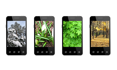 Image showing four smart-phones with colored images of seasons