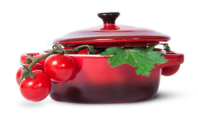 Image showing Cherry tomatoes on stem and parsley in saucepan