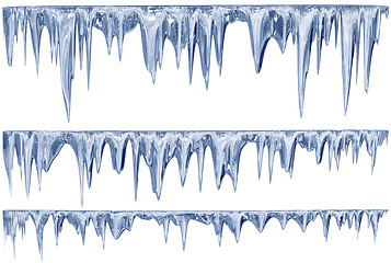 Image showing set of hanging thawing icicles of a blue shade