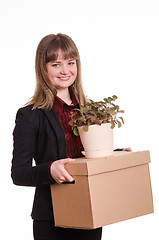 Image showing Portrait a girl adopted to work with things in hands of