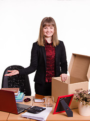 Image showing Girl in the office gets a new workplace