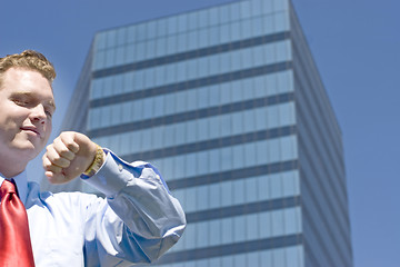 Image showing Businessman checking time