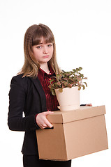 Image showing Portrait of a girl with box fired and flower in hands