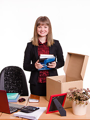 Image showing New employee in the office examines their stuff