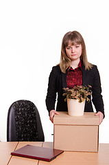 Image showing Dismissed girl in office to collect things a box