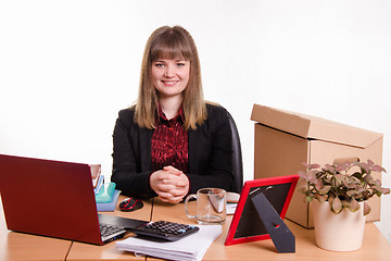 Image showing Business woman sitting at office table