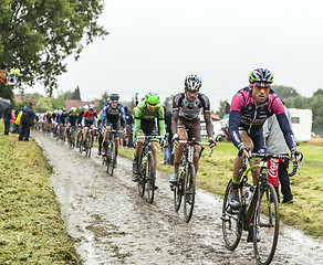 Image showing The Peloton on a Cobbled Road- Tour de France 2014