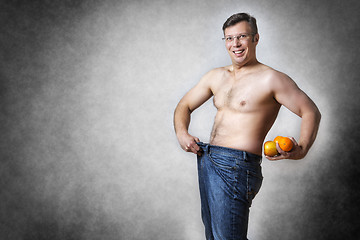 Image showing man with fruits has lost body weight