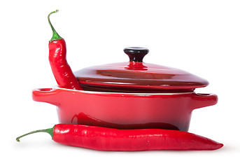 Image showing Two red chili peppers and saucepan with lid