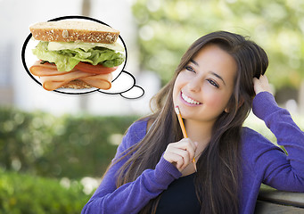 Image showing Pensive Woman with Big Sandwich Inside Thought Bubble