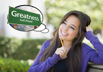 Image showing Young Woman with Thought Bubble of Greatness Green Road Sign 