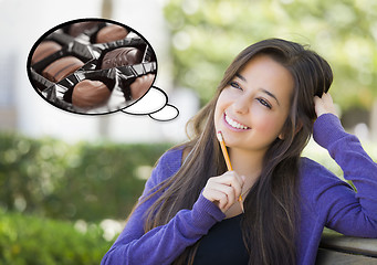 Image showing Pensive Woman with Chocolate Candy Inside Thought Bubble