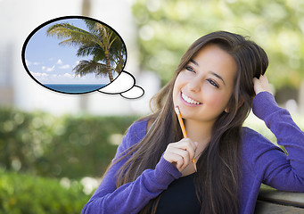 Image showing Pensive Woman with Tropical Scene Inside Thought Bubble