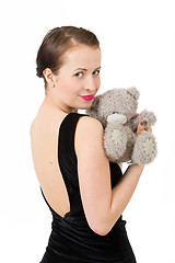 Image showing attractive smiling brunette holding teddy bear