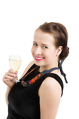 Image showing beautiful young brunette woman holding a glass of white wine