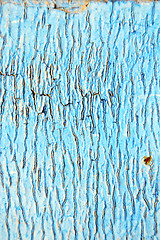 Image showing dirty stripped paint in  blue wood door  nail