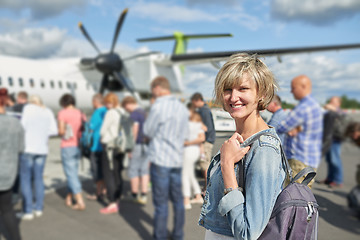 Image showing Woman with backpack going on boarding