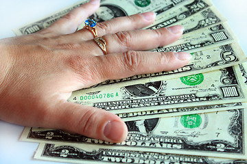 Image showing Hand holding US dollars isolated on the white