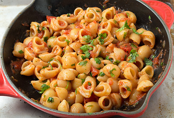 Image showing Elbow pasta arrabbiata mixed in a pan