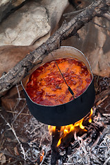 Image showing Cooking borscht (Ukrainian soup) on campfire