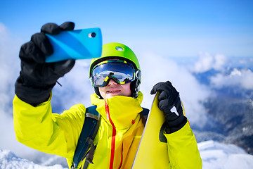 Image showing Man in winter clothes taking a selfie