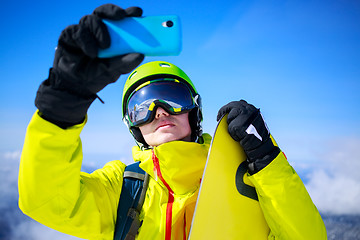 Image showing Man in winter clothes taking a selfie